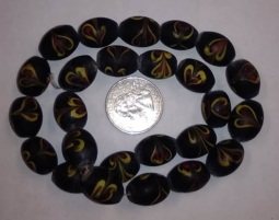 Black Oval with Red and Yellow Raked Stringer Heart Beads